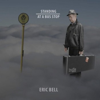 ERIC BELL - STANDING AT A BUS STOP - 